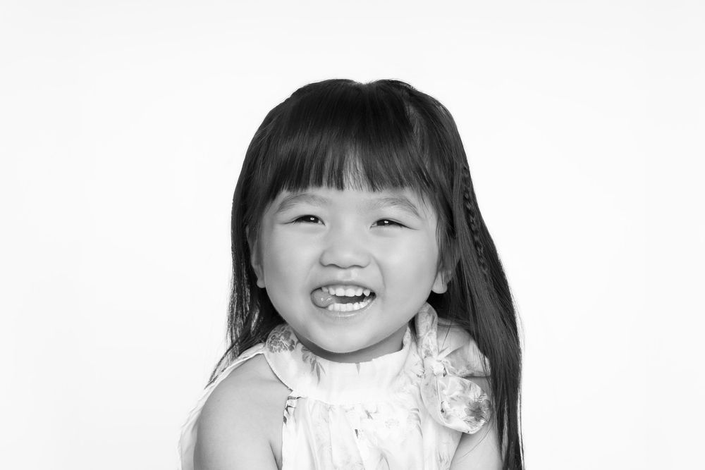 Portrait series showing joyful expressions against white background.