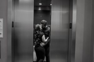 A series of black and white photos showing a couple embracing in an elevator.