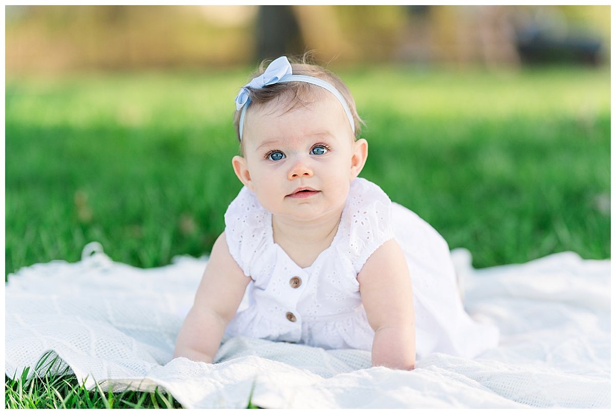 6 month old baby girl crawling portrait