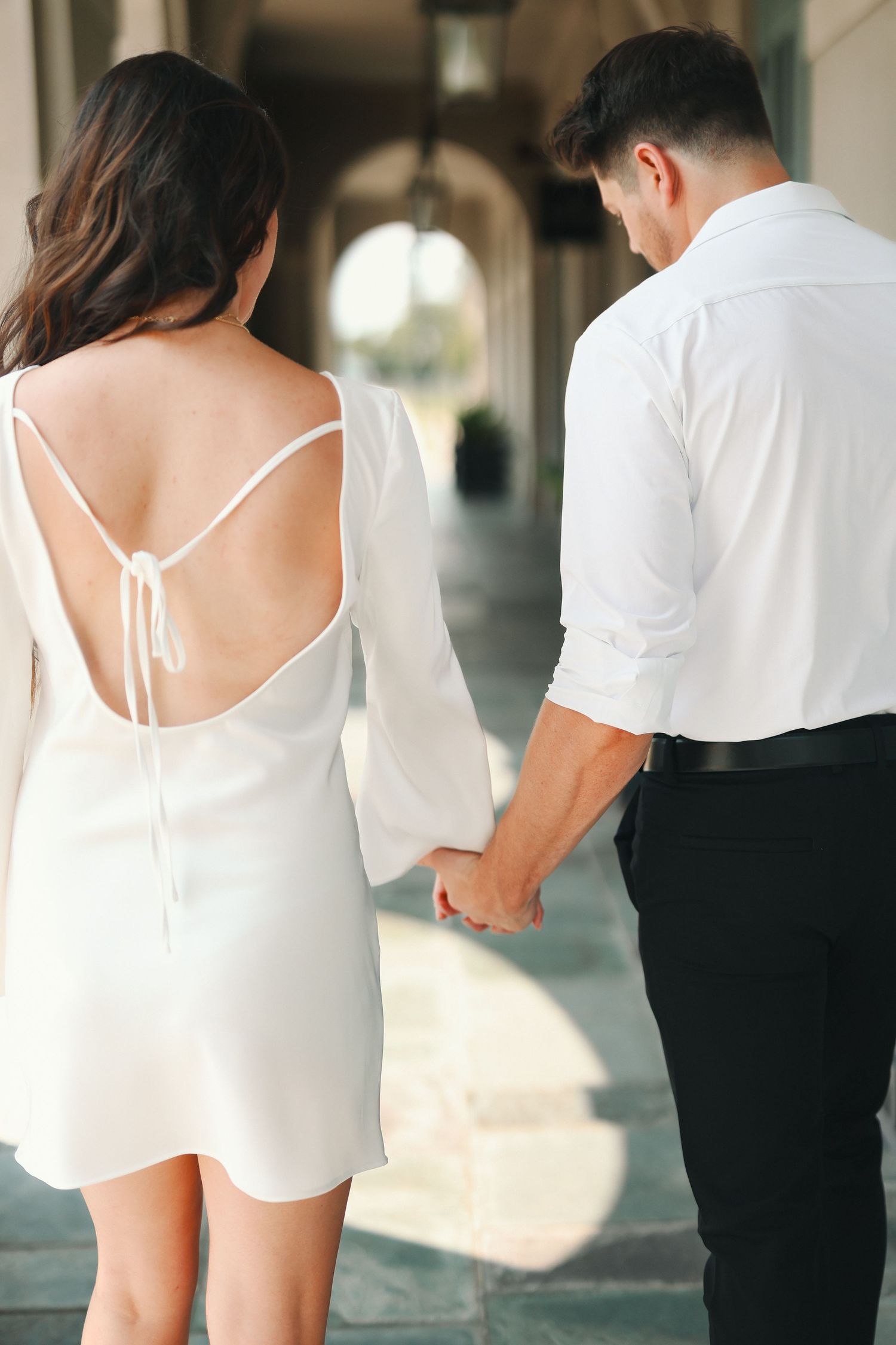 newly engaged couple walking downtown