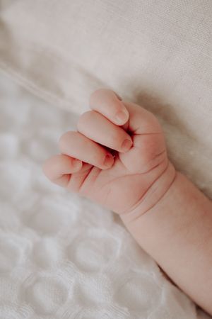Close up of newborn baby's hand.