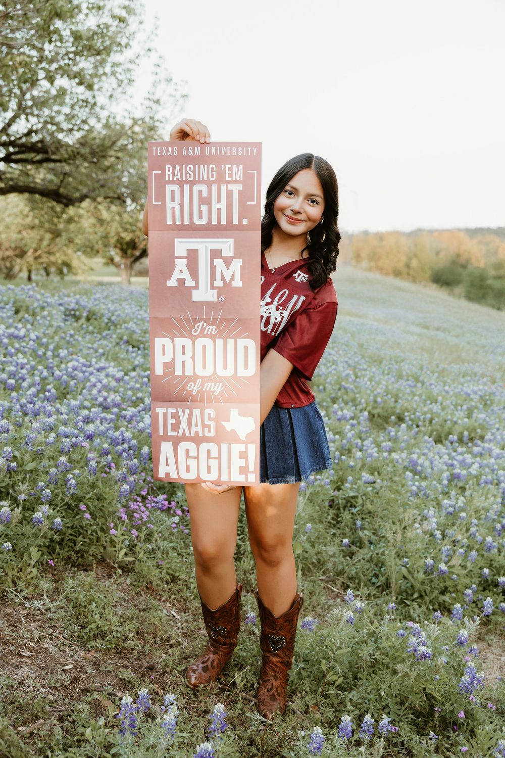 Houston senior photographer capturing modern high school senior portraits with bluebonnets