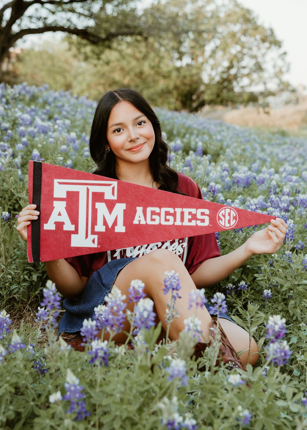 Houston senior photographer capturing modern high school senior portraits with bluebonnets