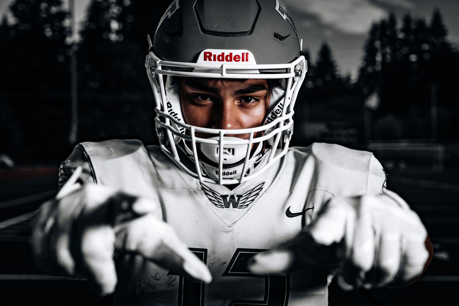 A close up photograph of a varsity football player from Woodinville High School.