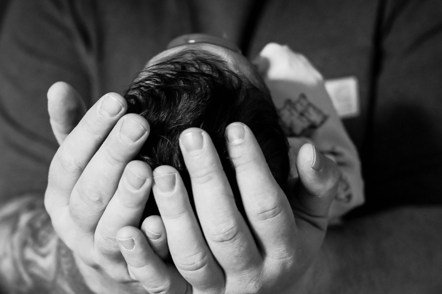 Black and white photo of a newborn during a lifestyle session in Hudson, NY