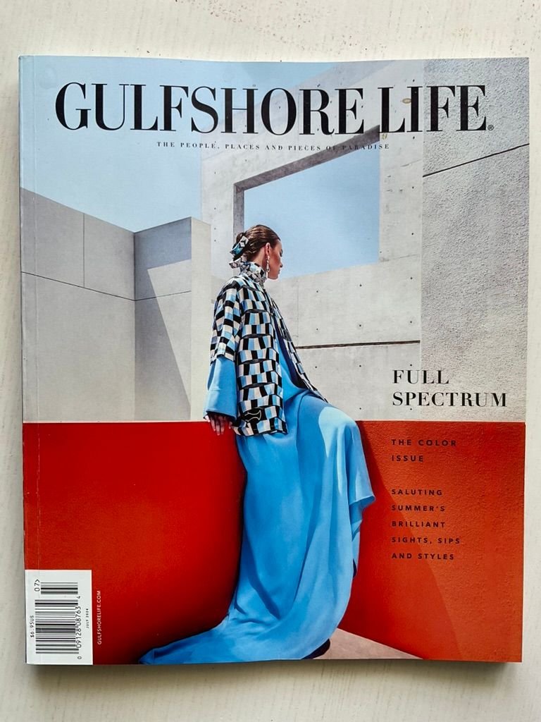 Cover of Gulfshore Life magazine featuring a model in a blue skirt and checkered top with Full Spectrum color issue headline.