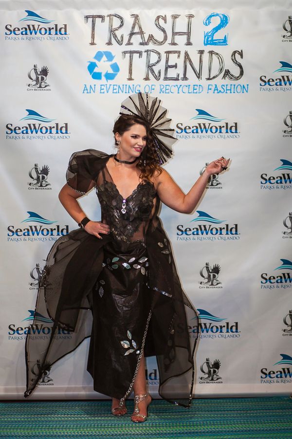 Dramatic black recycled material dress showcased at SeaWorld Trash 2 Trends fashion event.