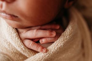 tiny fingers of newborn baby by Urso photography