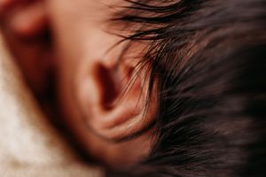 details of baby's ear and hair during newborn session detail photos