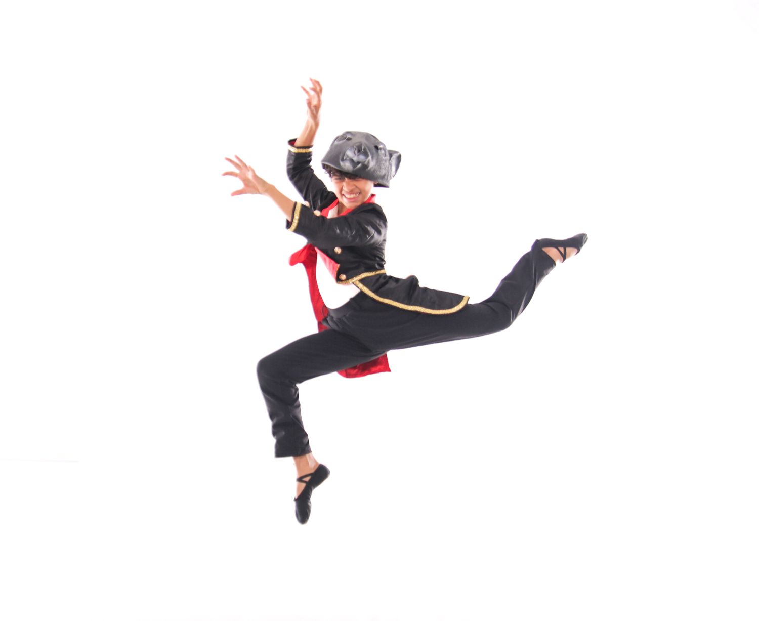 Dynamic sequence of a dancer leaping through the air in black and red attire.