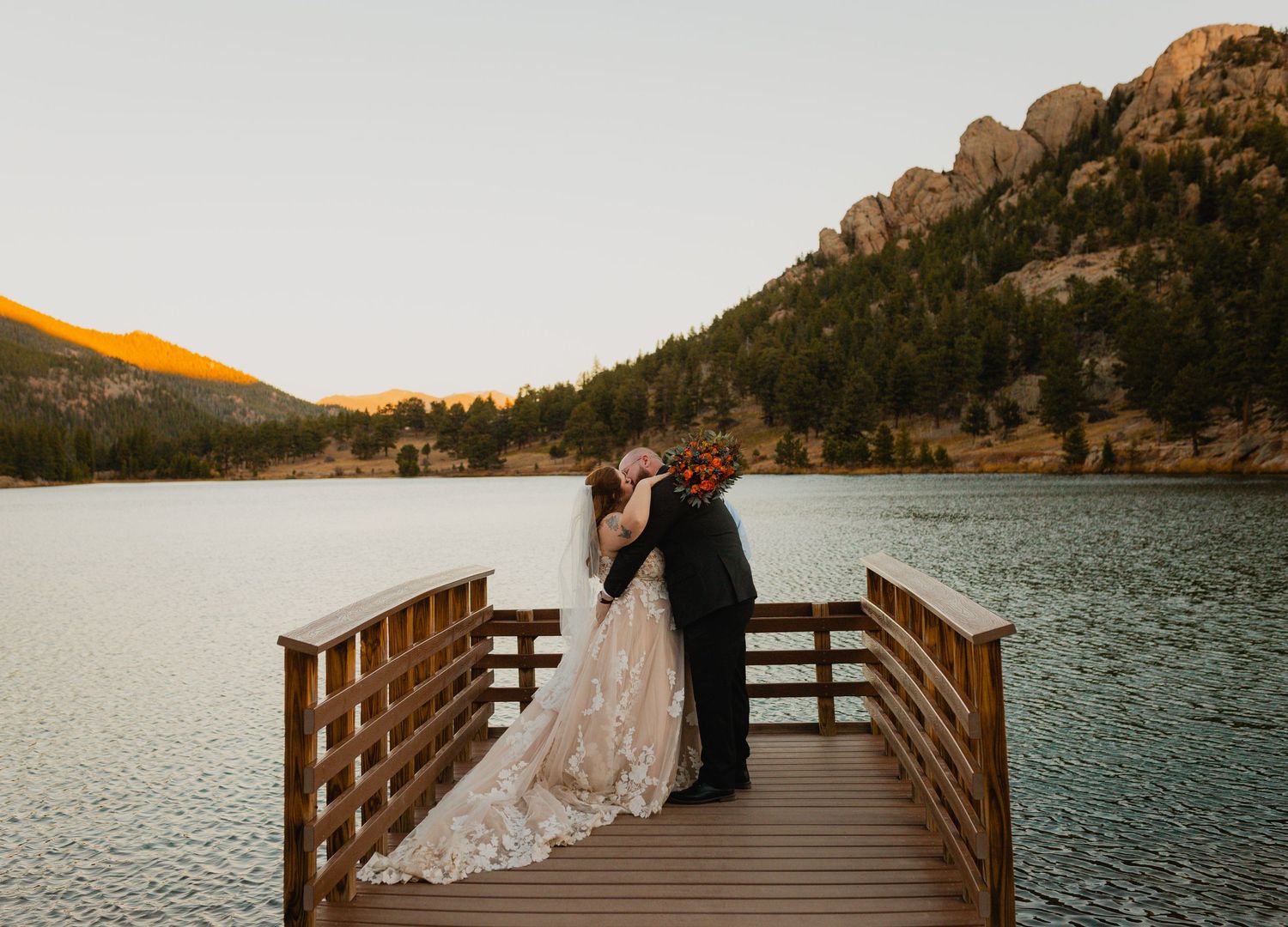 Skilled elopement photographer photographing a serene and picturesque ceremony in the heart of Colorado's captivating sc