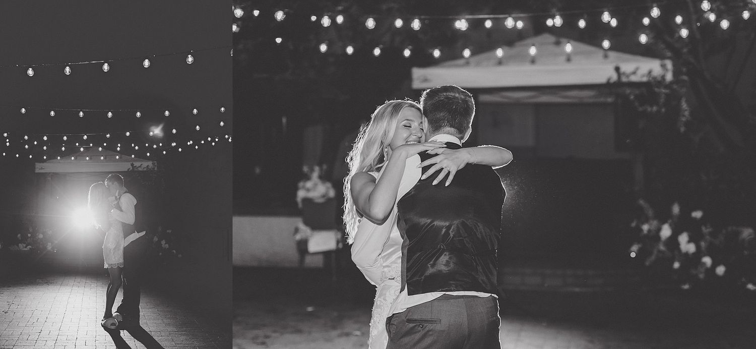 Romantic first dance silhouettes under sparkling string lights at outdoor reception.