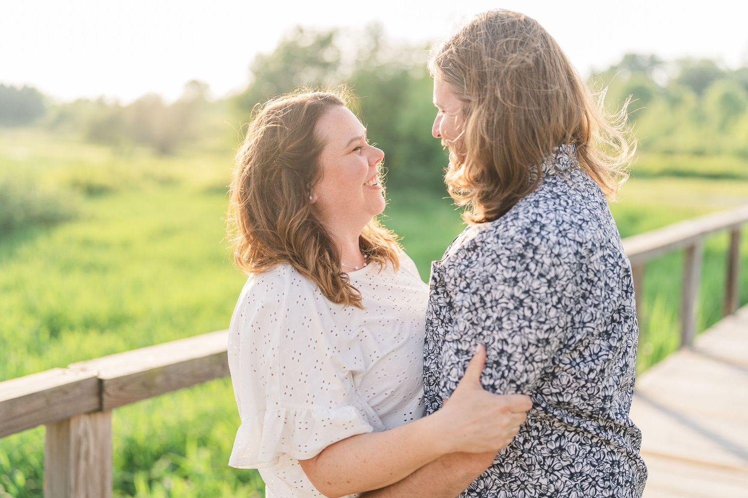 Engaged couple laughing and playfully interacting during their Kenosha engagement session.