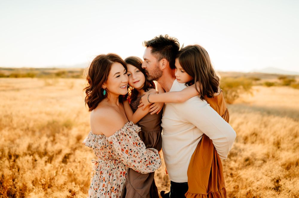 family hugging in desert during sunset, emotional outdoor family portraits Tucson.
