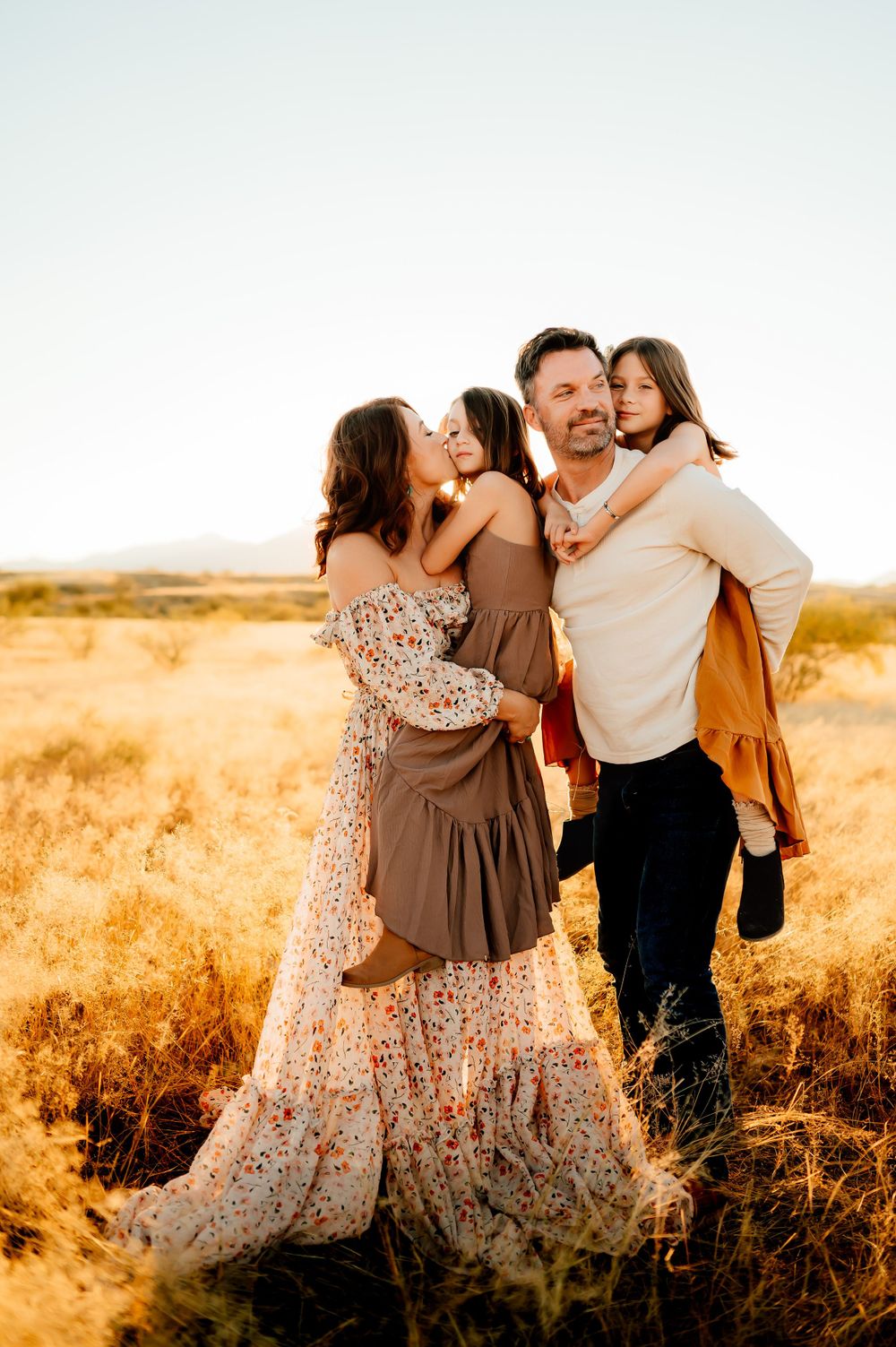 Natural family portraits in Sierra Vista with Arizona mountain backdrop