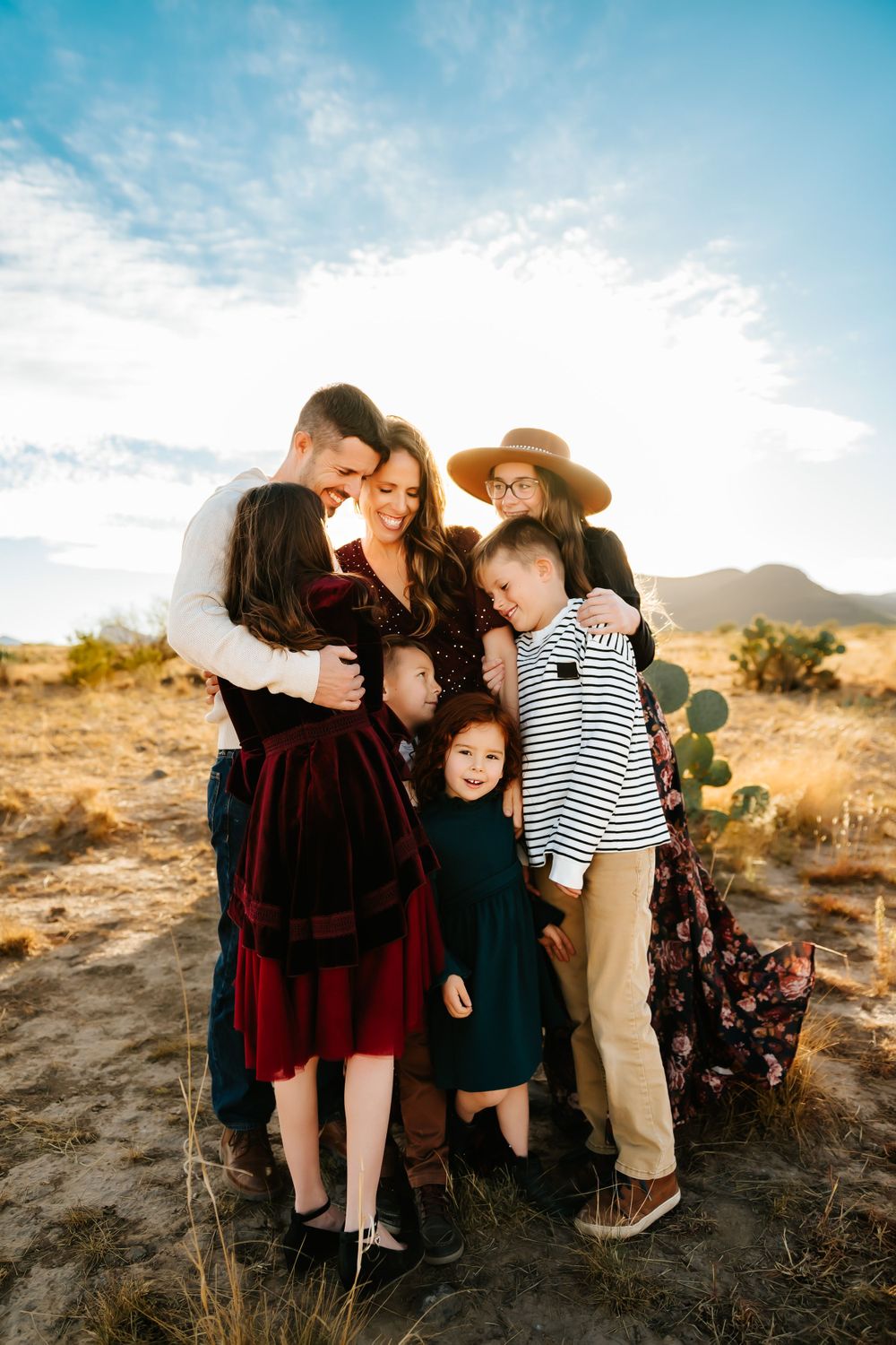 Bold and colorful outdoor family portrait of mother and daughters in Tucson, relaxed and joyful session