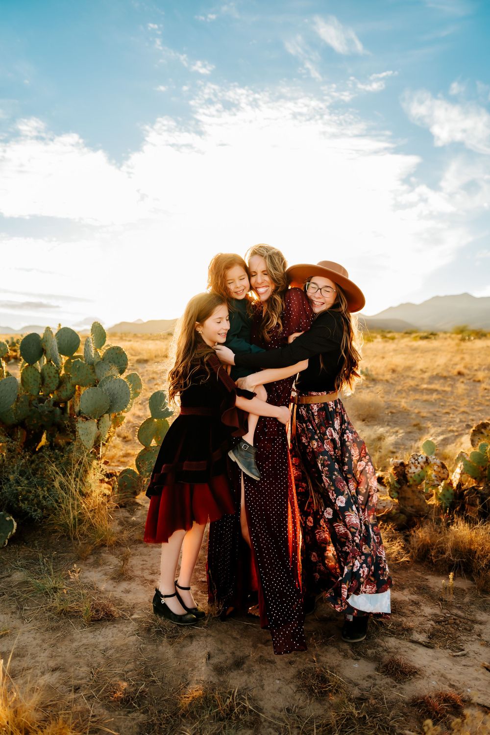 Hugging family during sunset family session in Sierra Vista, AZ