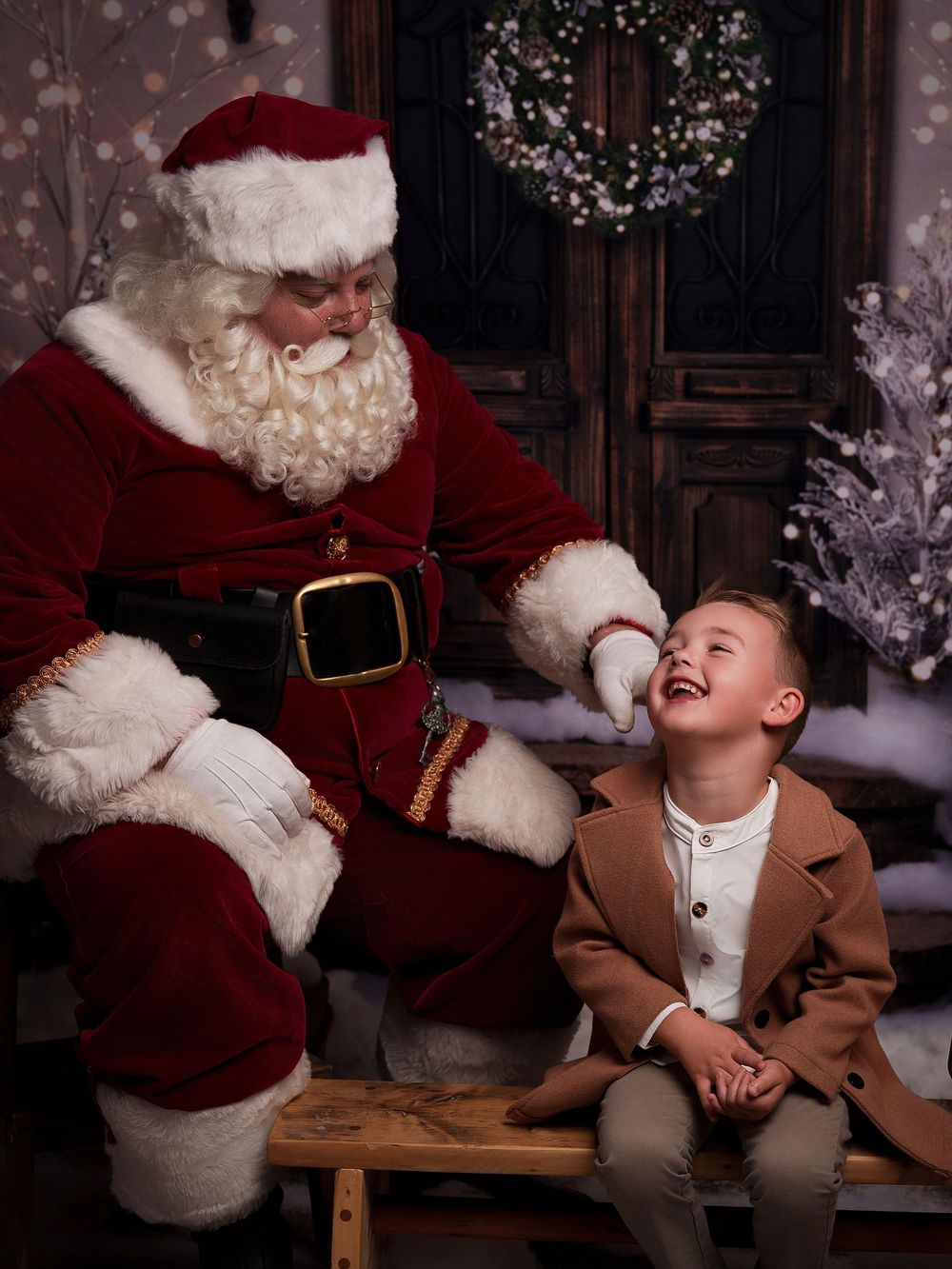 A sequence of joyful holiday photos showing a child in a brown coat sharing laughter-filled moments with Santa on a bench.