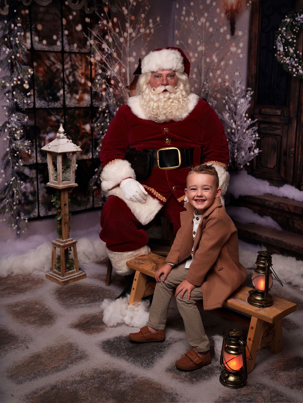 A festive holiday portrait scene with traditional Christmas decorations including lanterns and snowy backdrop.