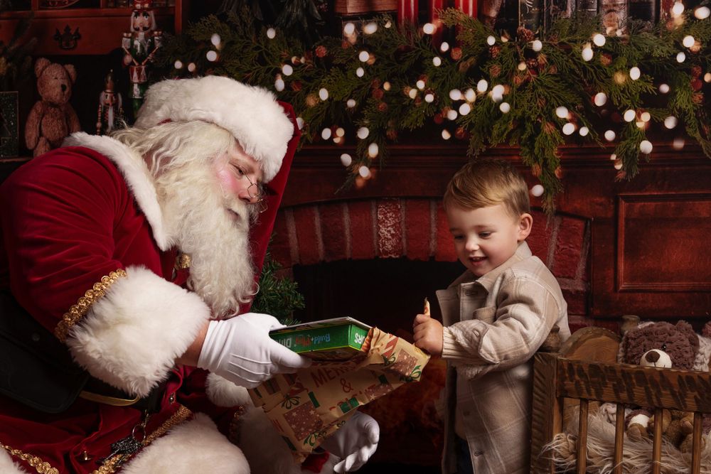 A heartwarming holiday moment with wrapped presents and Christmas decorations.