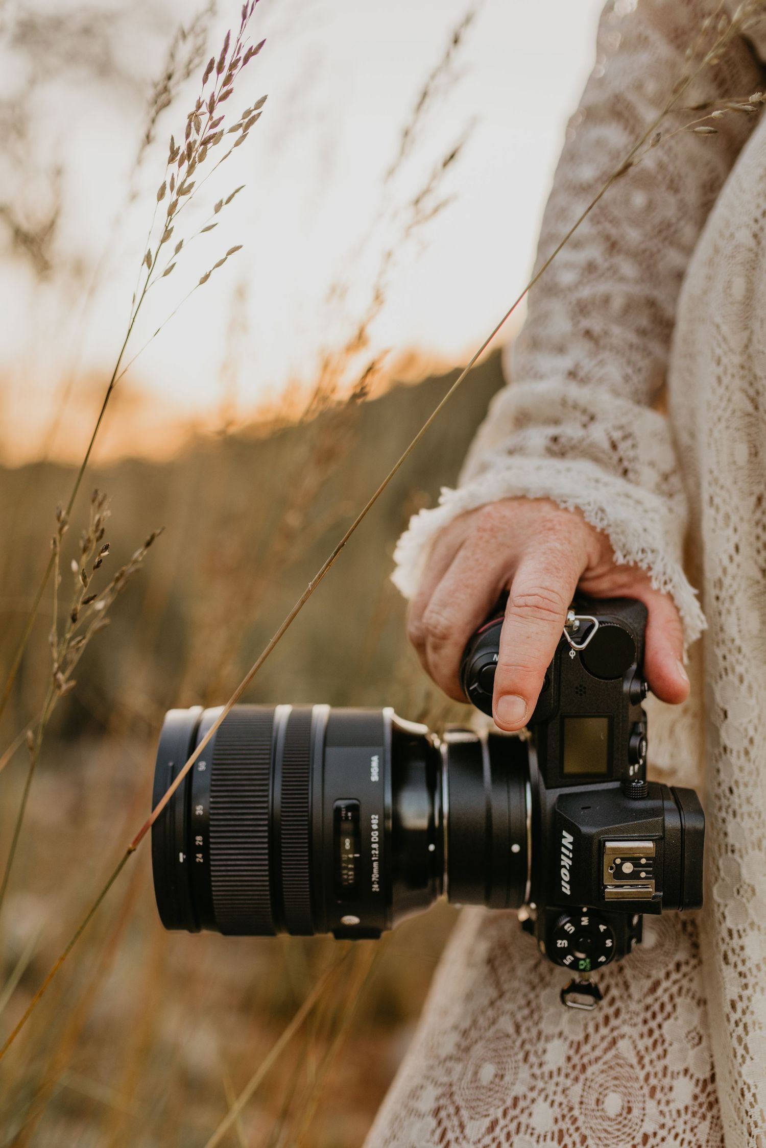 close up of woman holding her camera