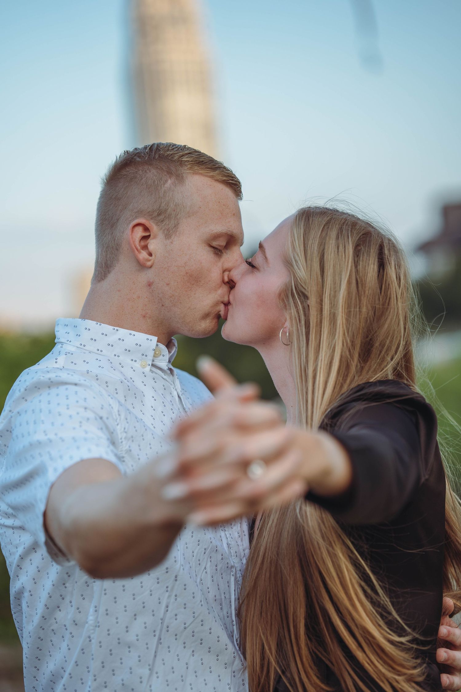 A sweet kiss shared between the couple, expressing their love and affection