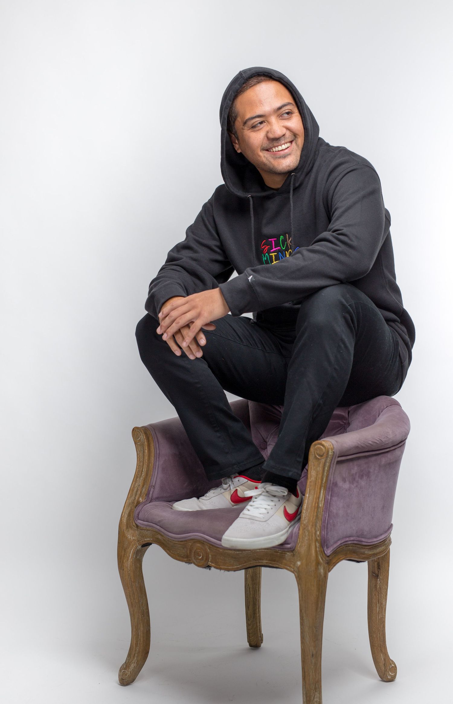male clothing model sitting on chair