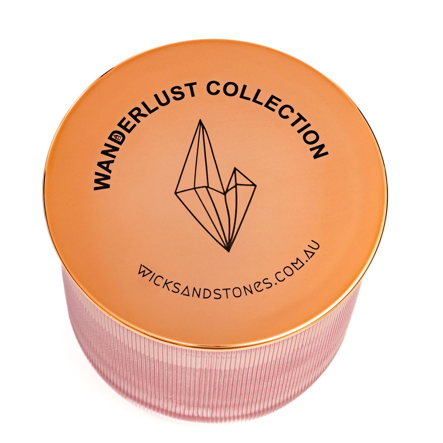Orange and pink cylindrical container with Wanderlust Collection logo featuring geometric crystal design on lid.