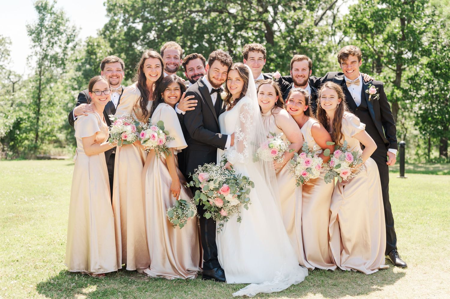Wedding party poses for bridal party portraits at Camp Loughridge in Sapulpa, OK.