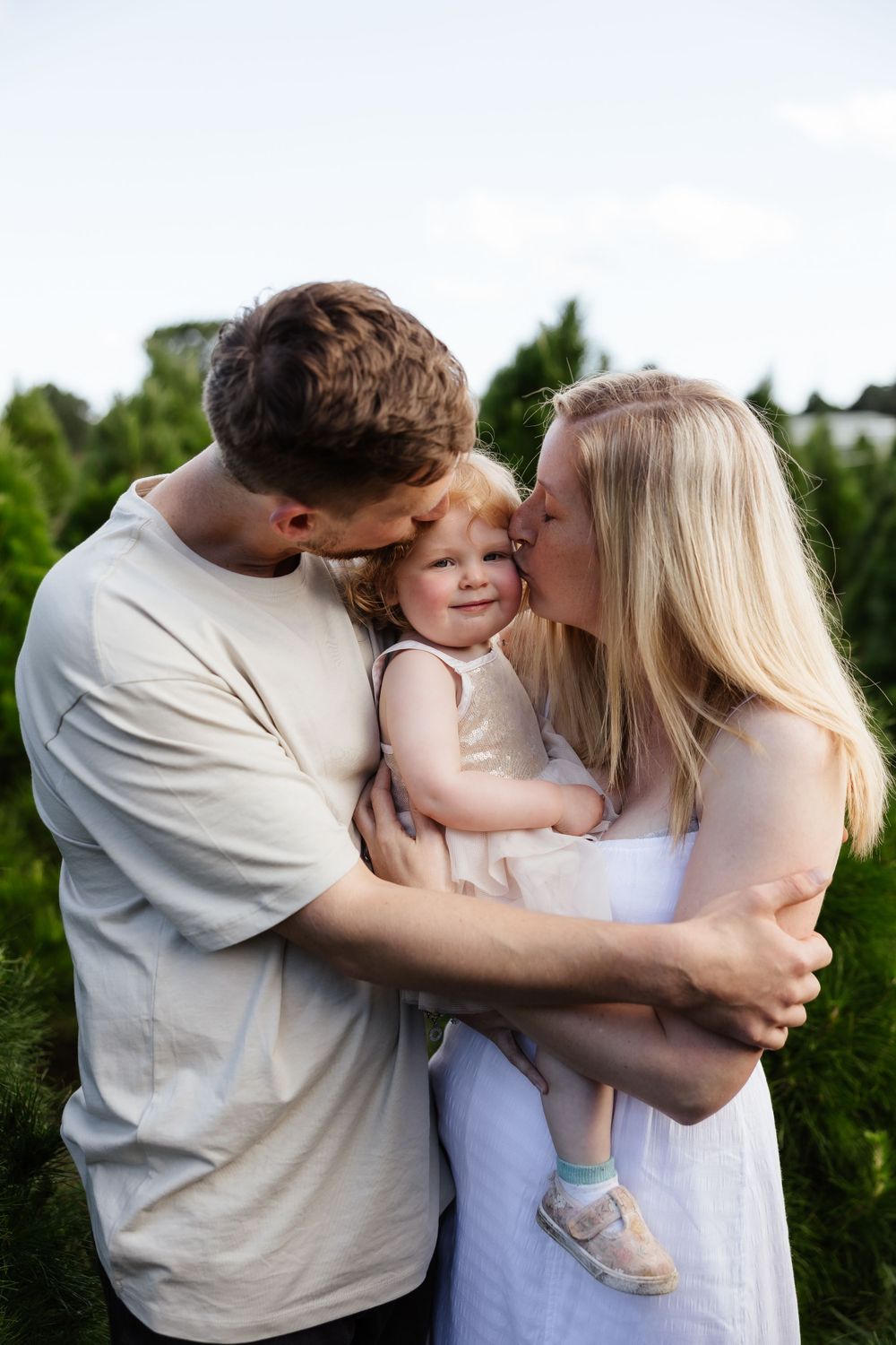 Tender family moment shared between loved ones outdoors.