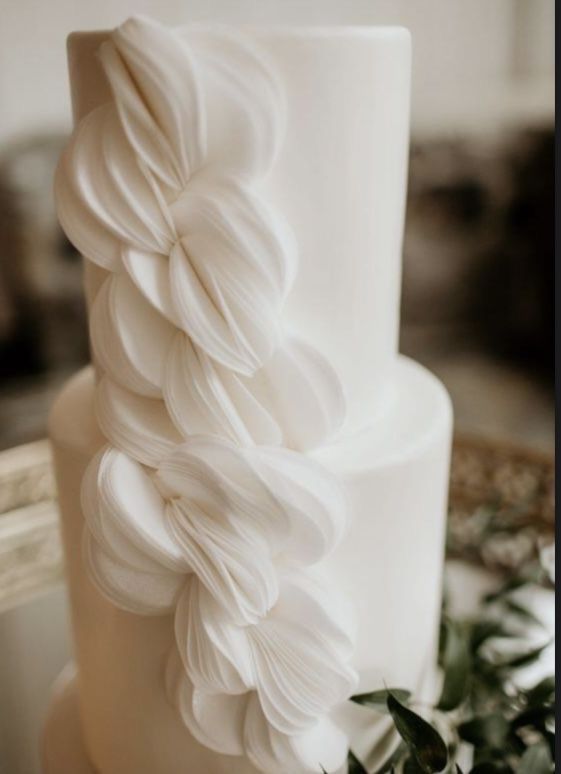 elegant-wedding-cake-with-floral-details-at-budapest-reception-romantic-three-tier-design-classic-style.jpg