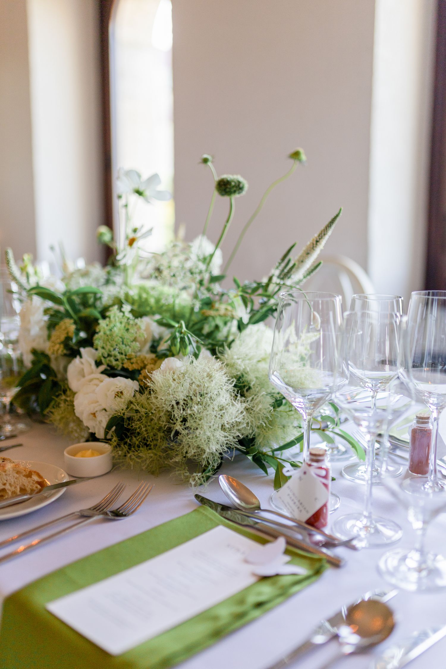 fishermans-bastion-wedding-reception-table-decorated-with-flowers-candles-and-elegant-place-settings-in-budapest.jpg