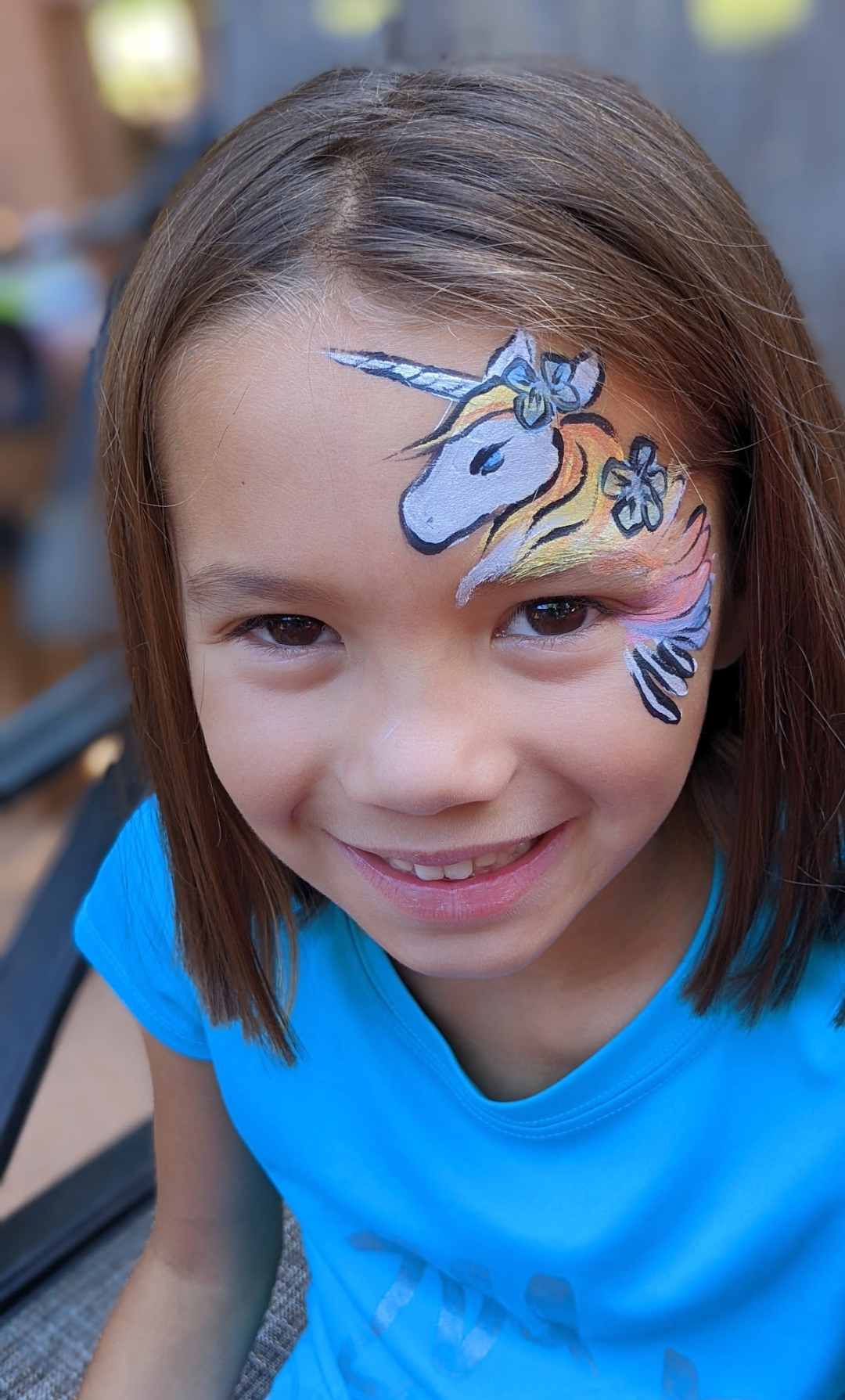 Child face paint of unicorn for birthday party in Plain City, OH. Book with face paint artist, Maria Palmer, Columbus.