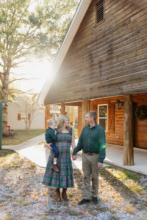 A series of five similar photos showing people interacting outside a rustic wooden building in natural sunlight.