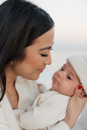 Intimate close-up portraits showing gentle affection between family members.