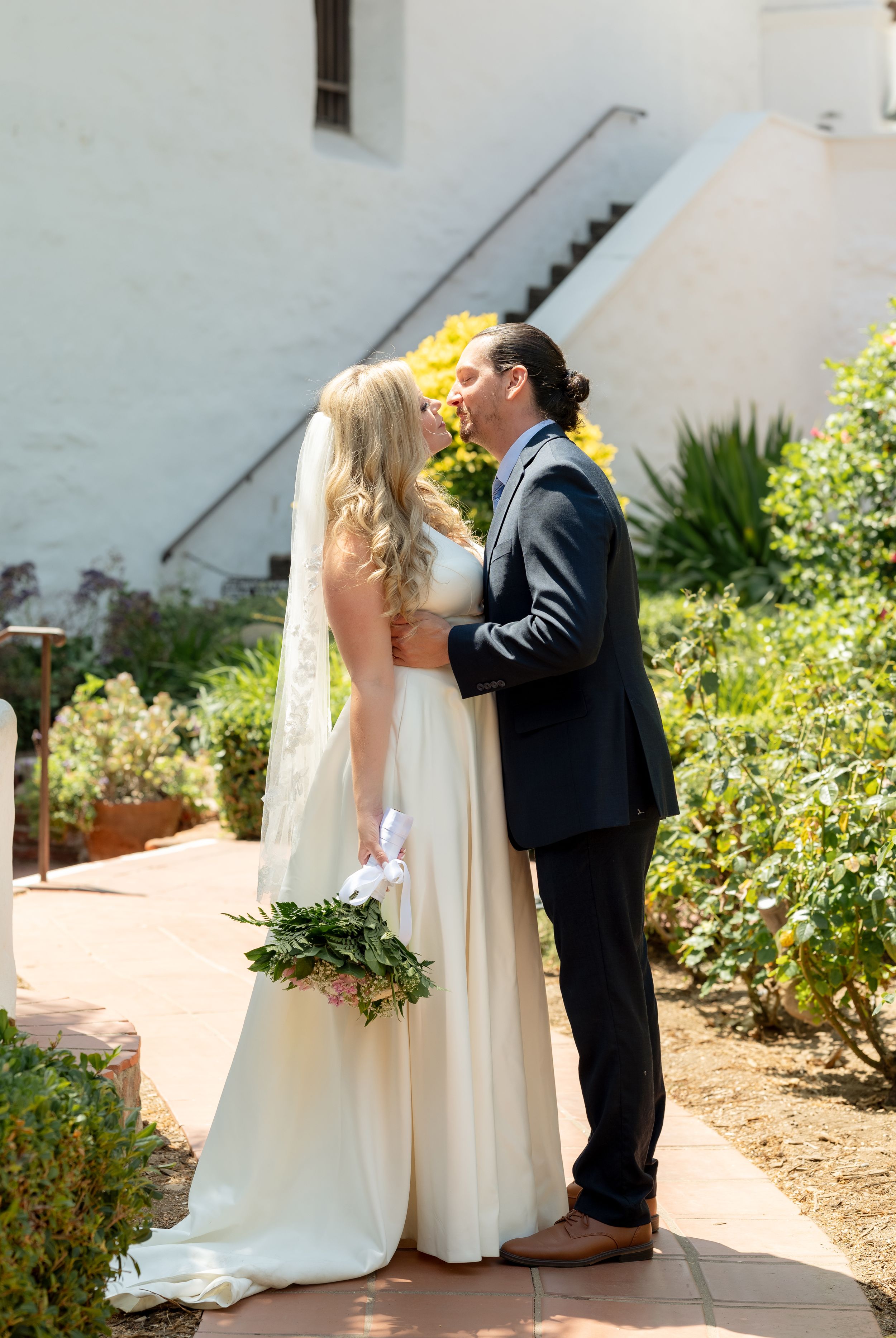 bride and groom wedding portrait at the Mission Basilica San Diego de Alcala