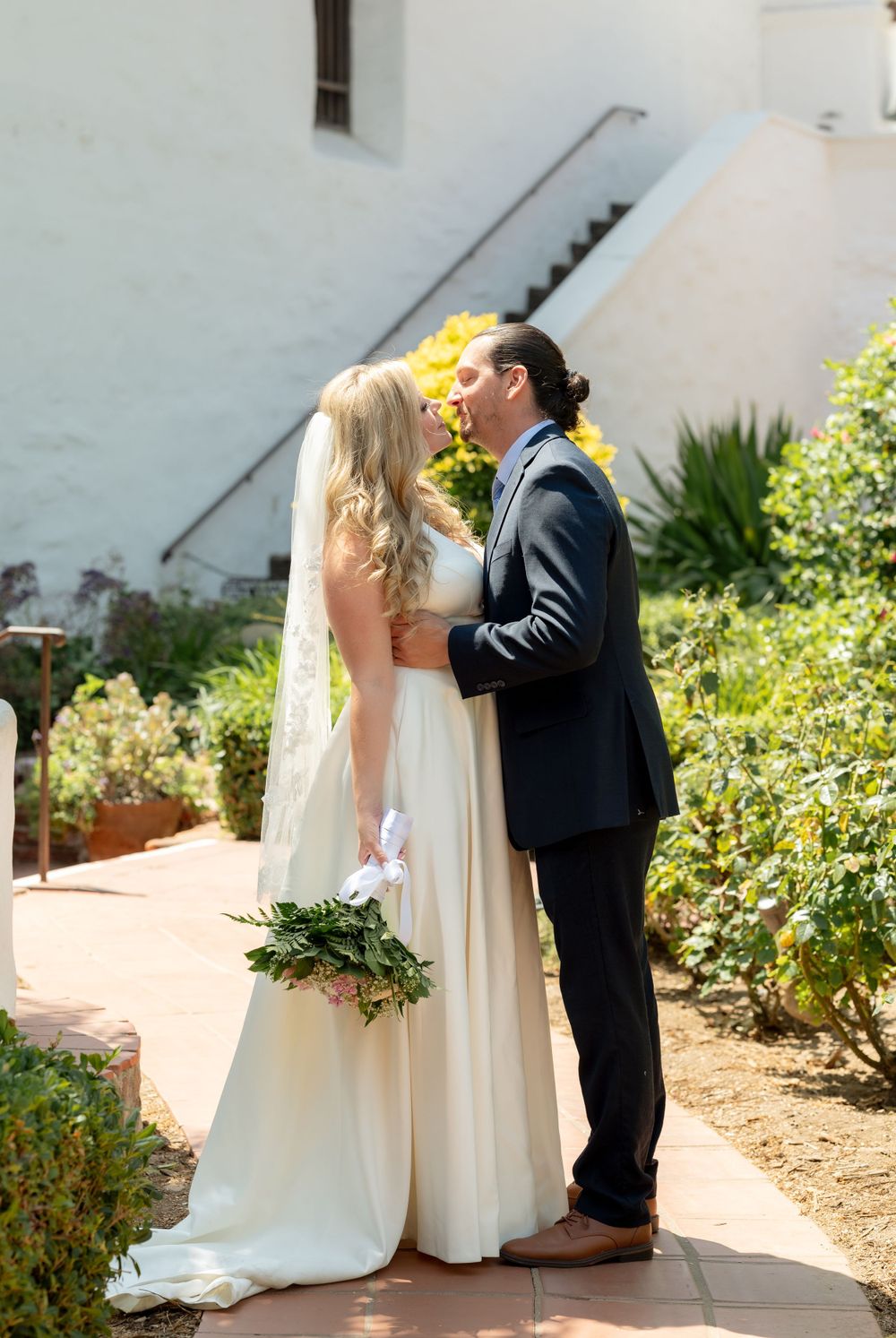 bride and groom wedding portrait at the Mission Basilica San Diego de Alcala