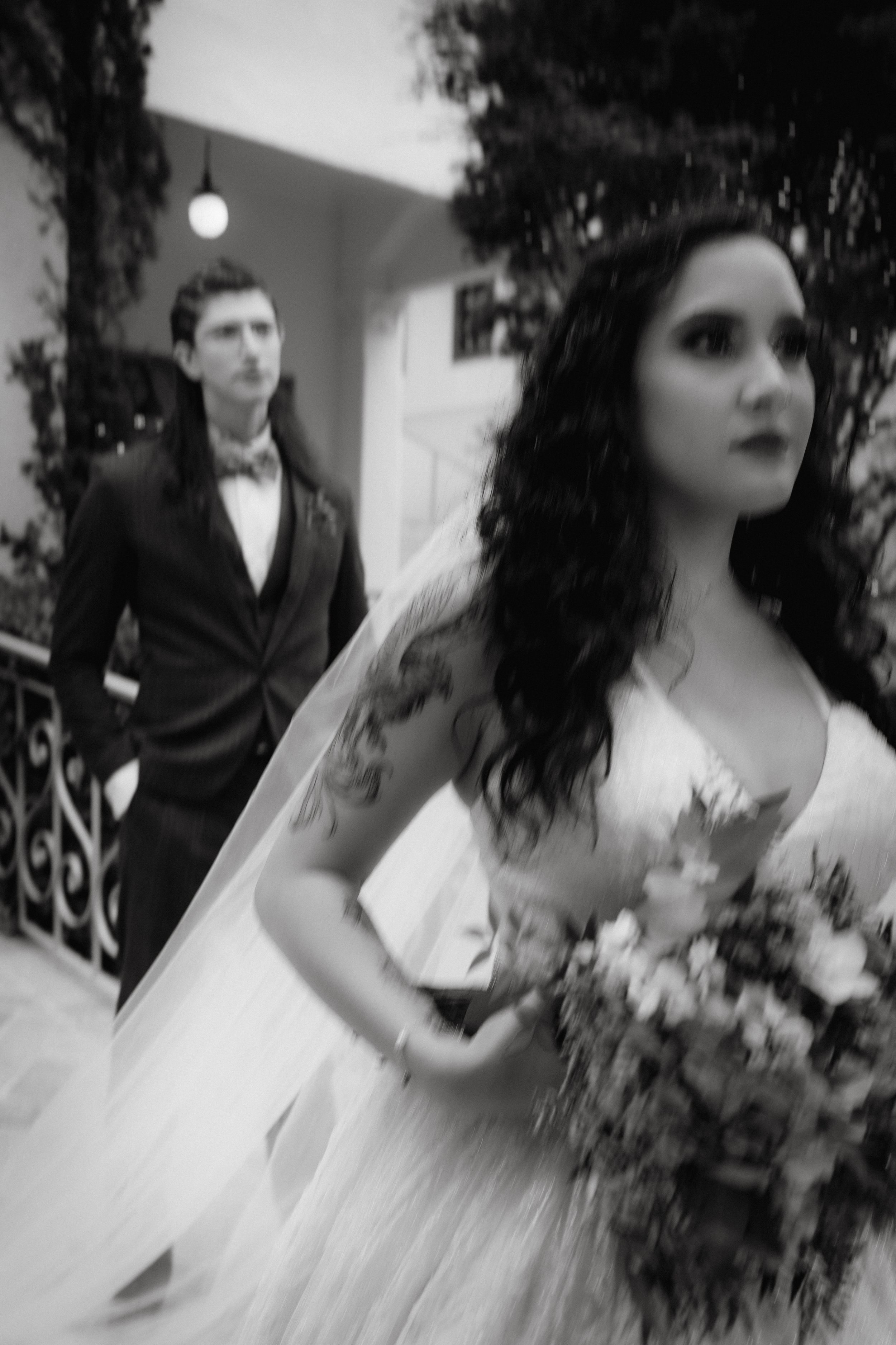 Artistic black and white wedding photography series capturing intimate moments with dark romantic aesthetic.