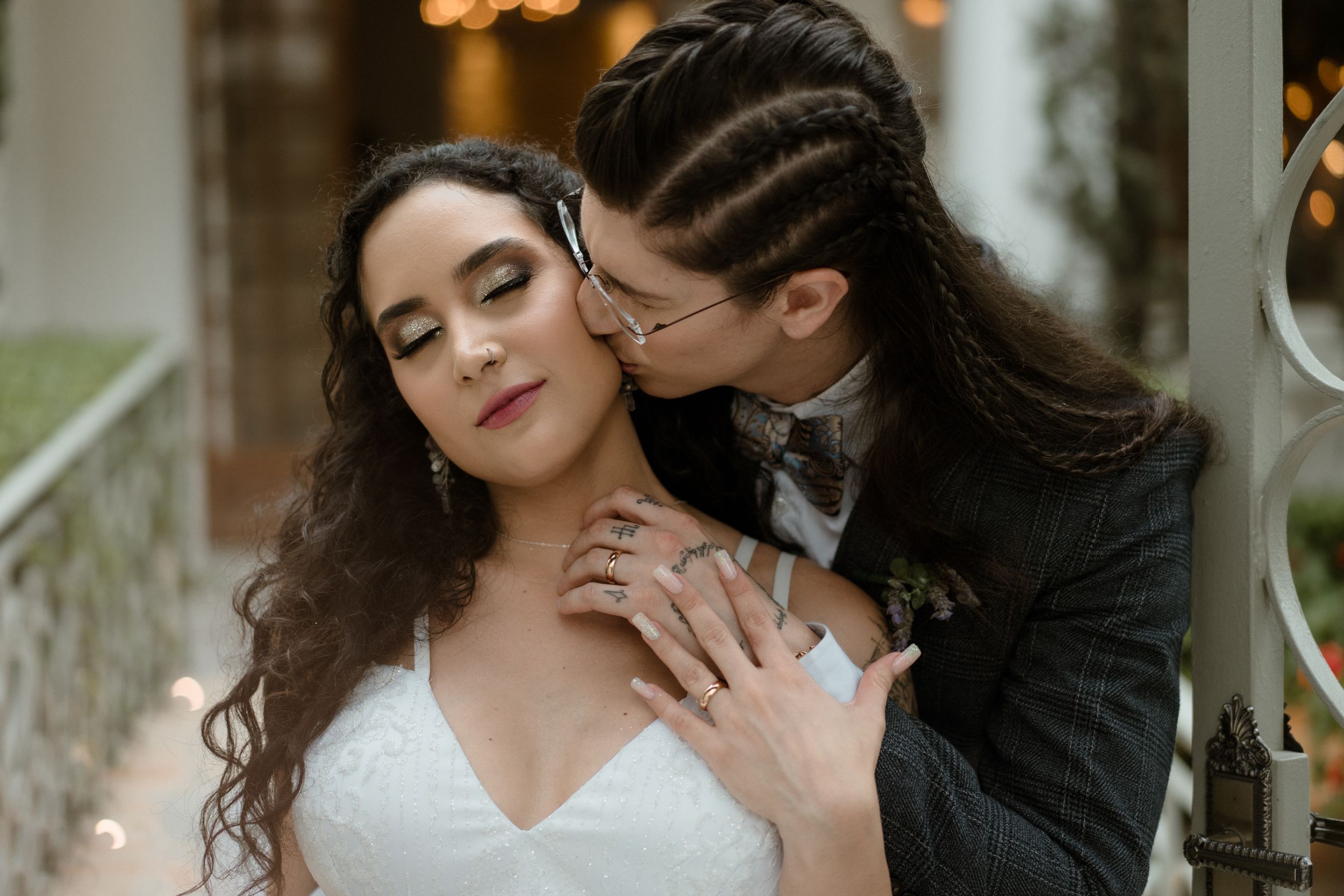 Romantic wedding couple embracing in intimate portrait series.