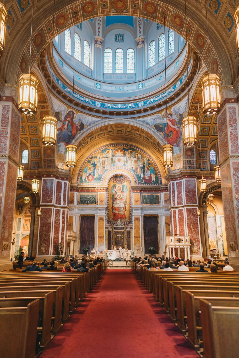Joyous wedding procession inside St. Matthew the Apostle Cathedral