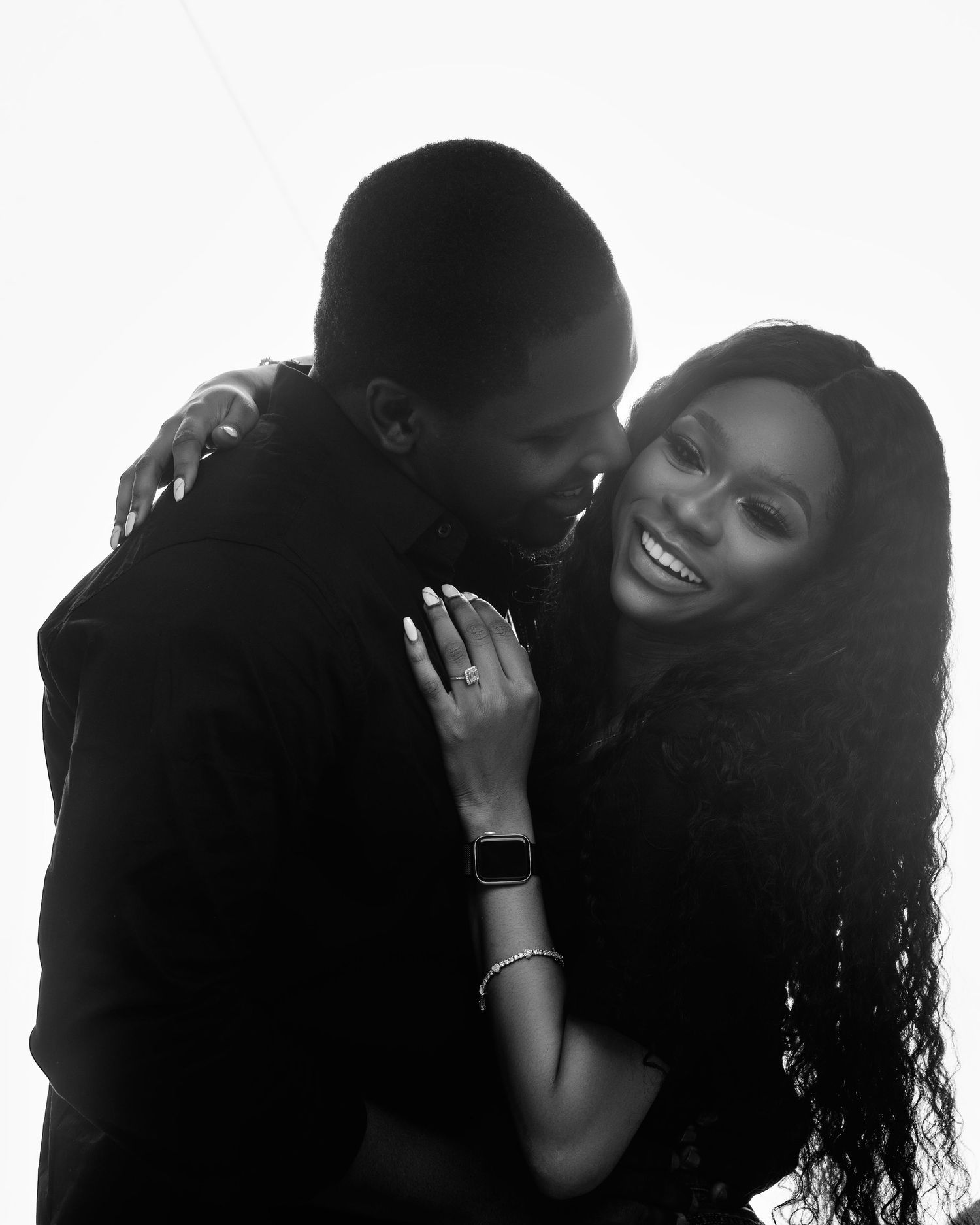 A romantic black and white photoshoot showing intimate couple moments.