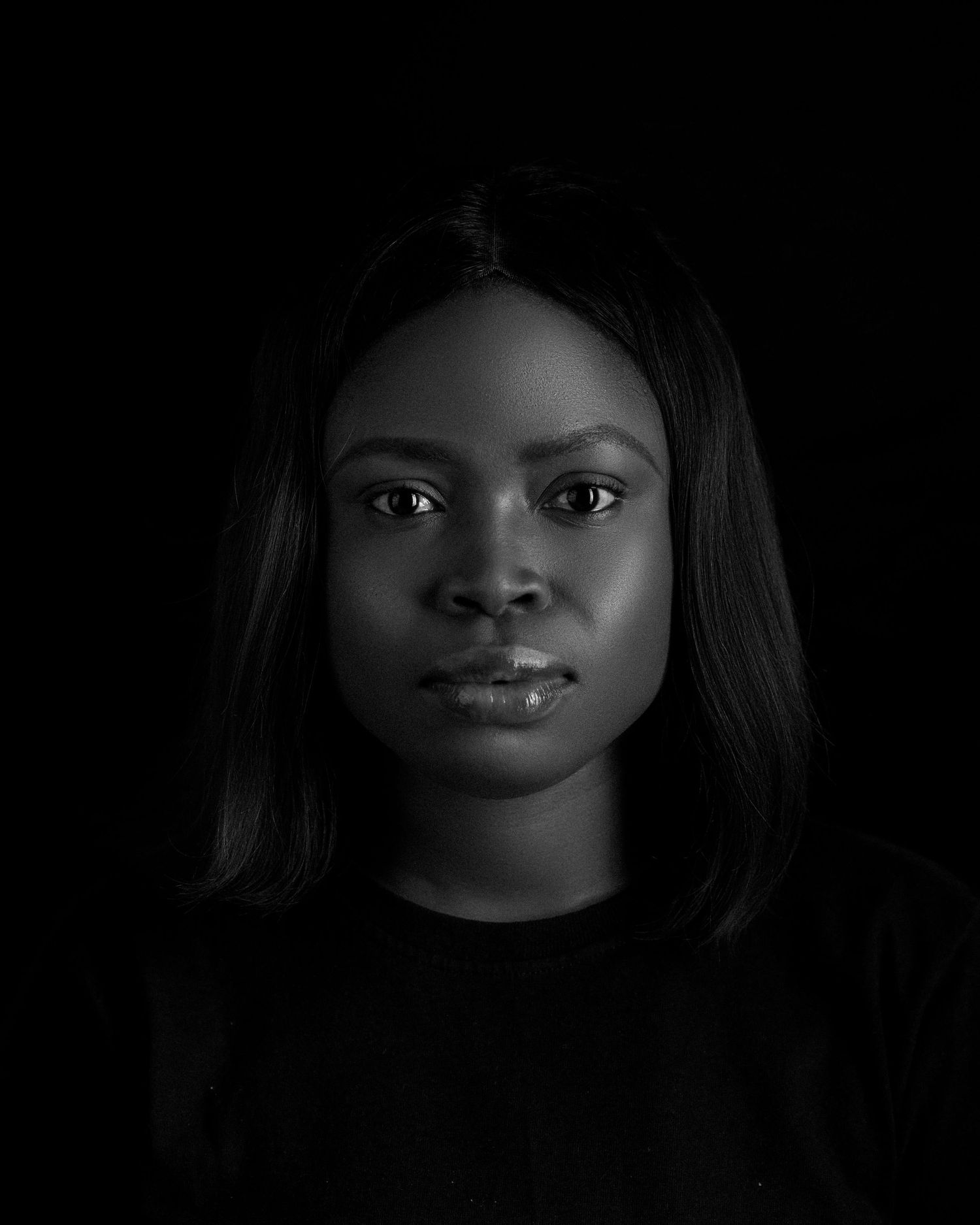 A series of dramatic black and white portraits captured in low key lighting.