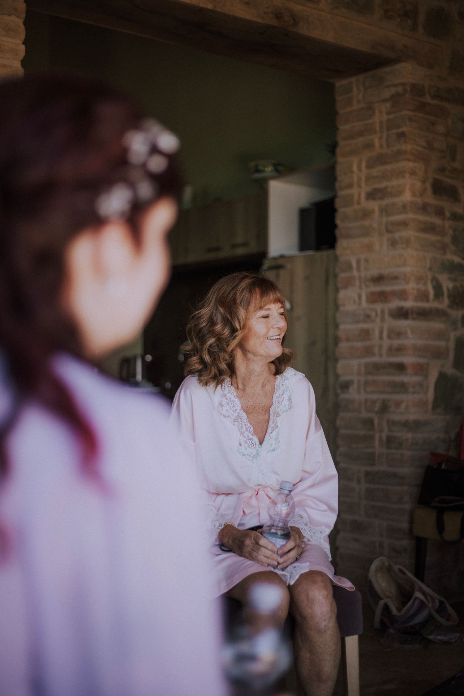 Bride's mom getting ready at Perugia Vecchia Relais photographed by Gianluca e Arianna Wedding Photographers in Umbria, Italy.