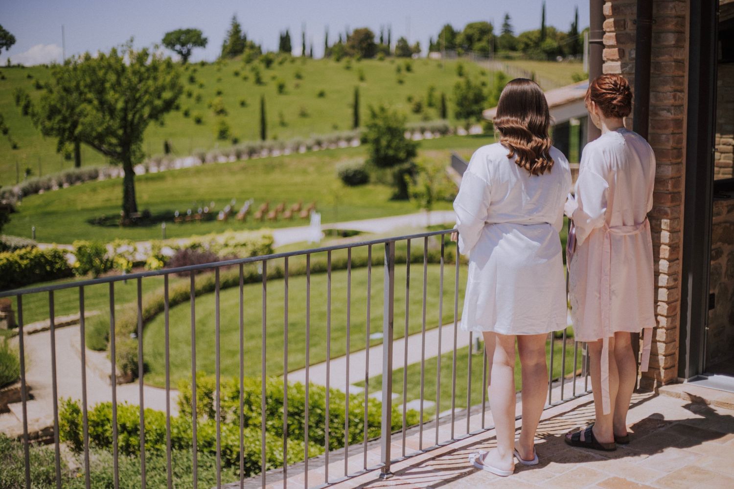 Bridesmaid looking at the beautiful countryside outside Perugia Vecchia Relais pictured by Gianluca e Arianna Wedding Photographers.