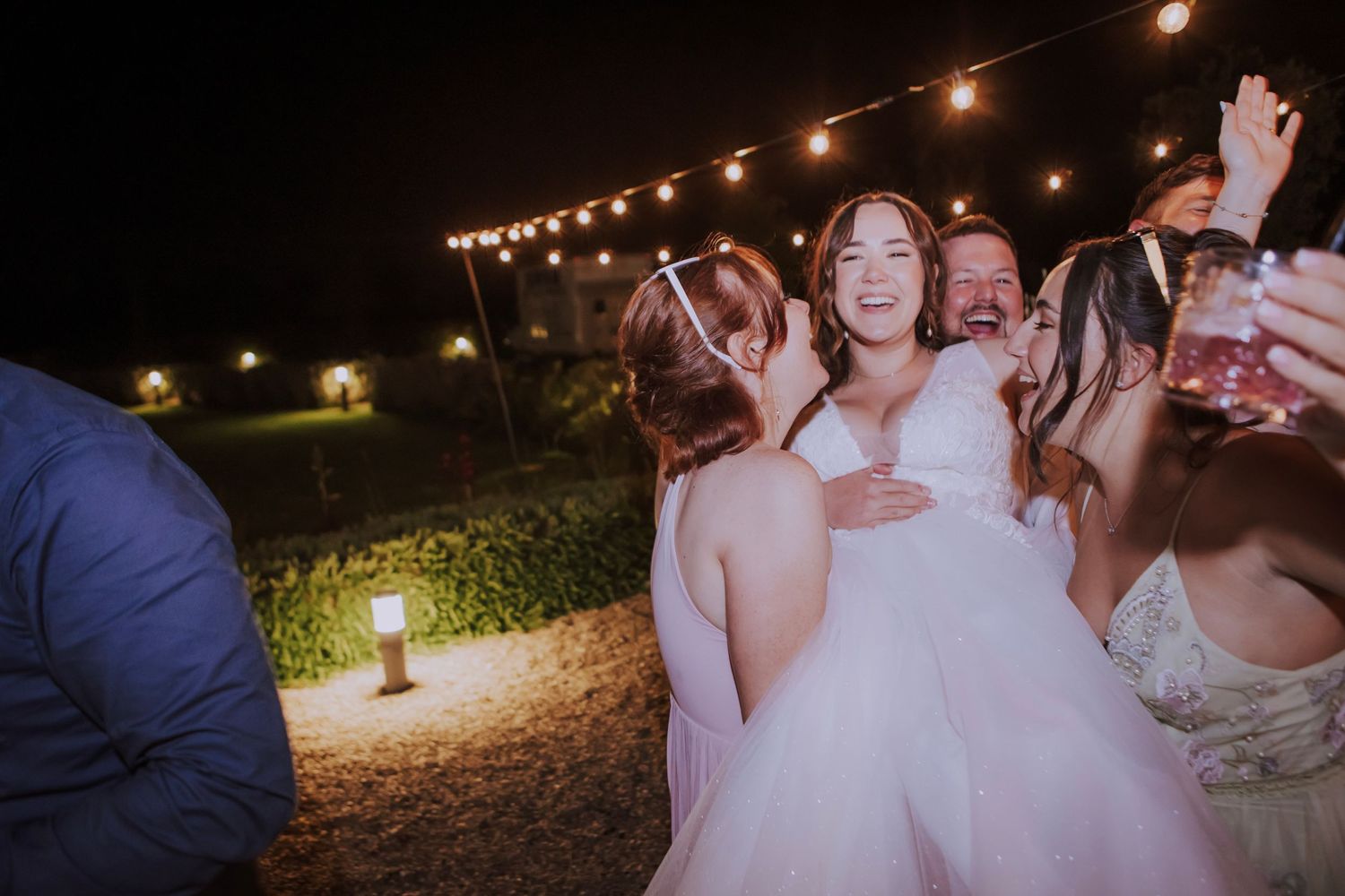 bride picked up by friends at her photographed by Gianluca e Arianna Wedding Photographers in Umbria, Italy.