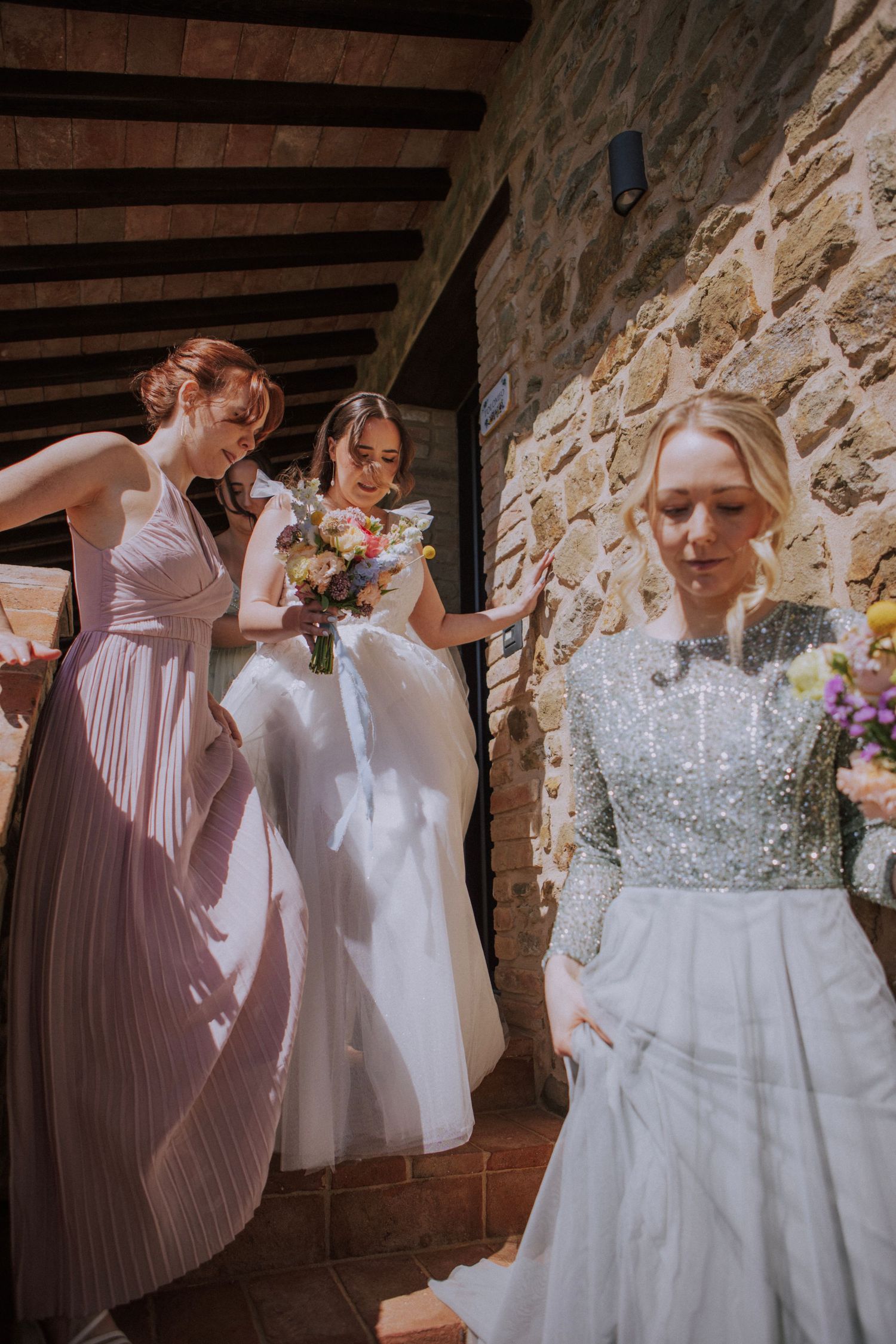 Bride with her sisters at Perugia Vecchia Relais photographed by Gianluca e Arianna Wedding Photographers in Umbria, Italy.