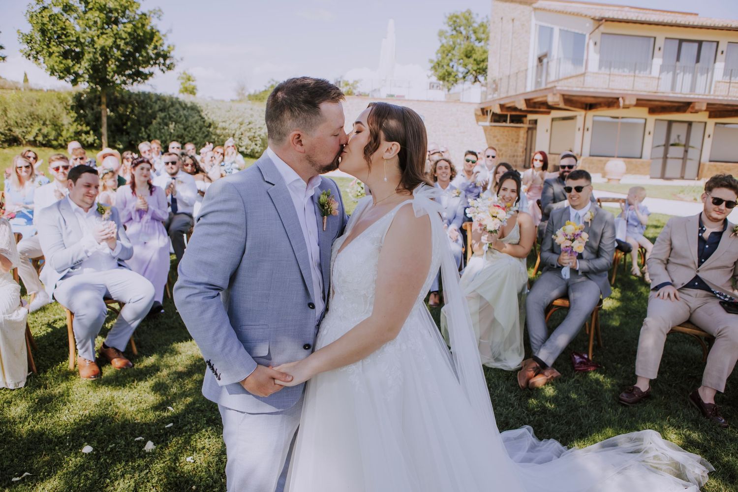 Abbieann and Paul kissing at Perugia Vecchia Relais photographed by Gianluca e Arianna Wedding Photographers in Umbria, Italy.