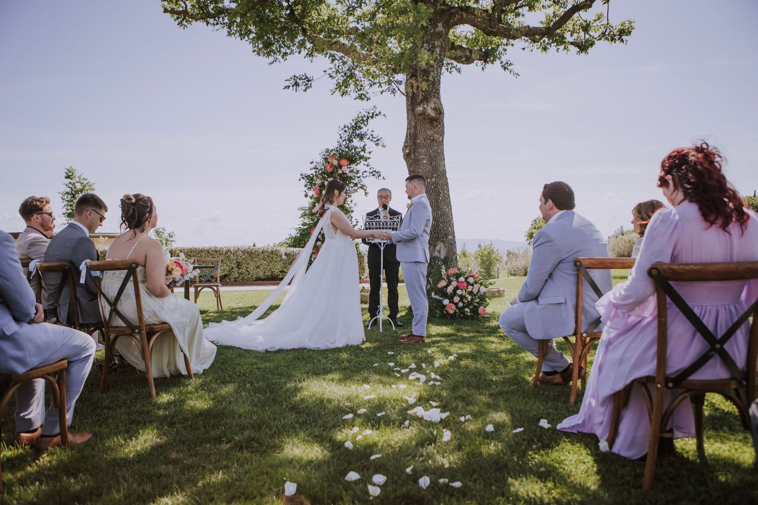 Abbieann and Paul's holding hands at their wedding, photographed by Gianluca e Arianna in Umbria, Italy.
