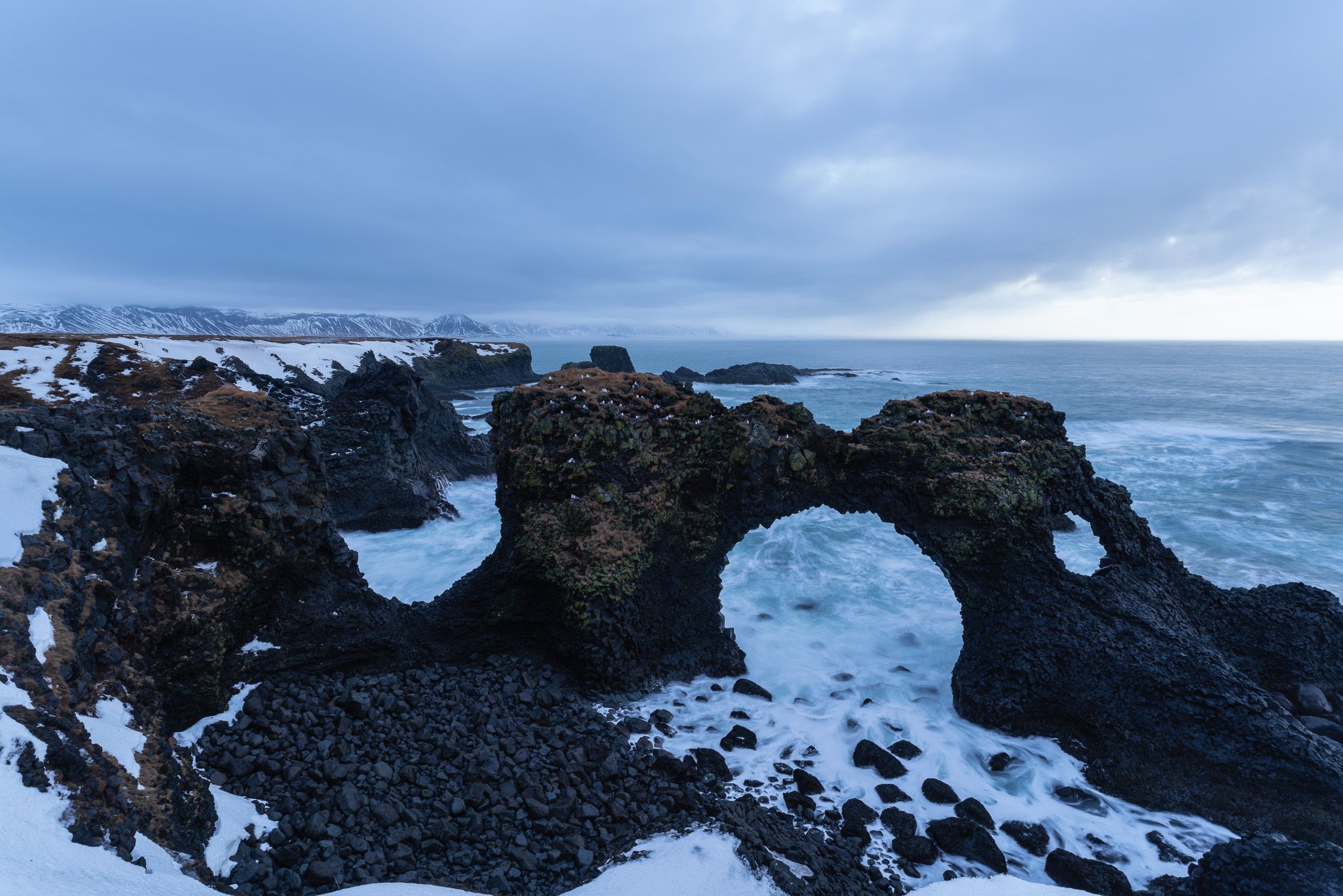 The stunning arches of Snaefellsnes peninsula captured on a cloudy day in winter.