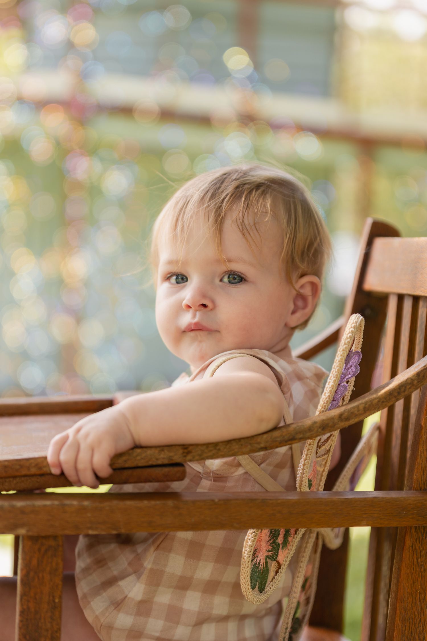 A wooden high chair captured in a series of intimate detail shots.